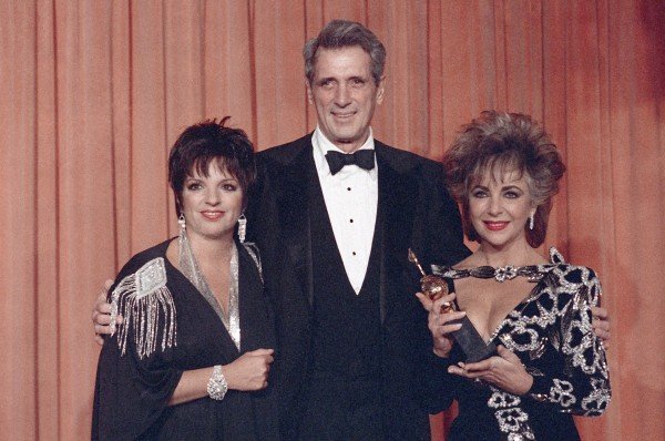 Actress Liza Minnelli, left, and actor Rock Hudson are seen with actress Elizabeth Taylor IN 1985 (Lennox McLendon/AP)